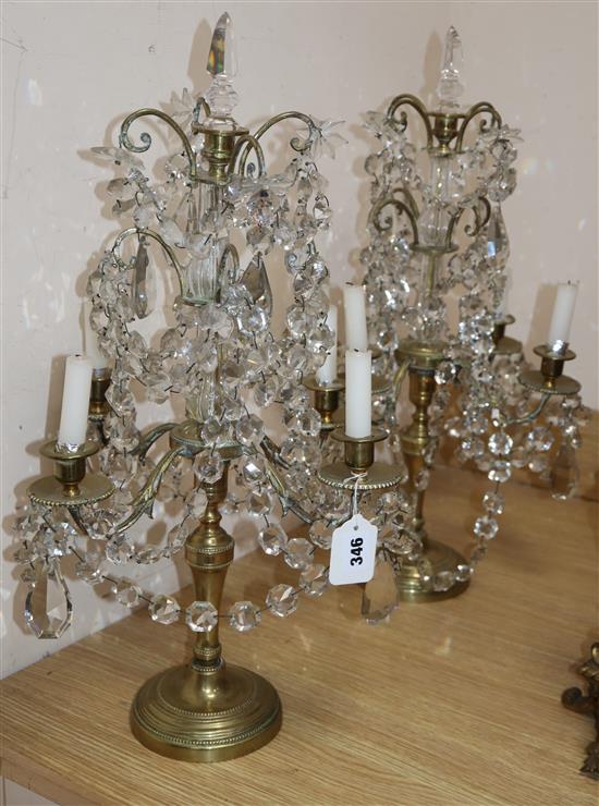 A pair of late 19th century Bohemian brass and lustre hung four branch candelabra, height 60cm (break to stem of one)